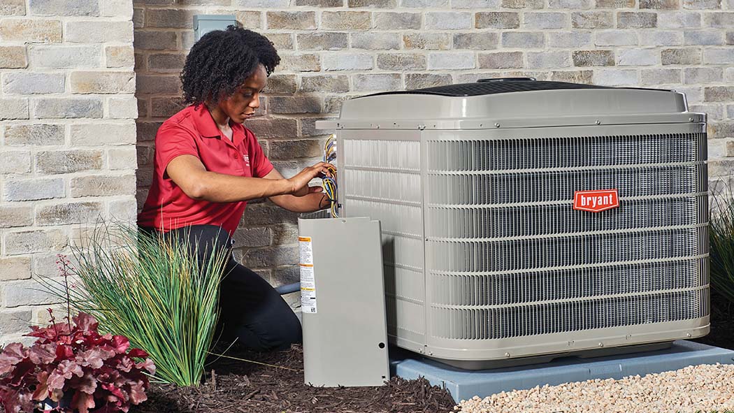 bryant dealer performing hvac maintenance