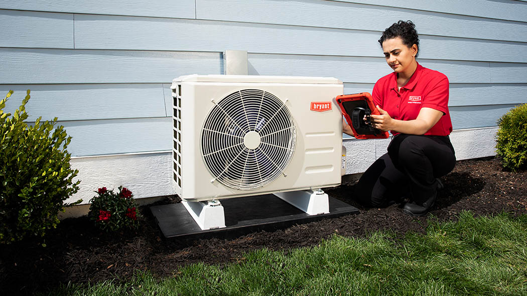 A Bryant dealer finishes performing a ductless mini split installation